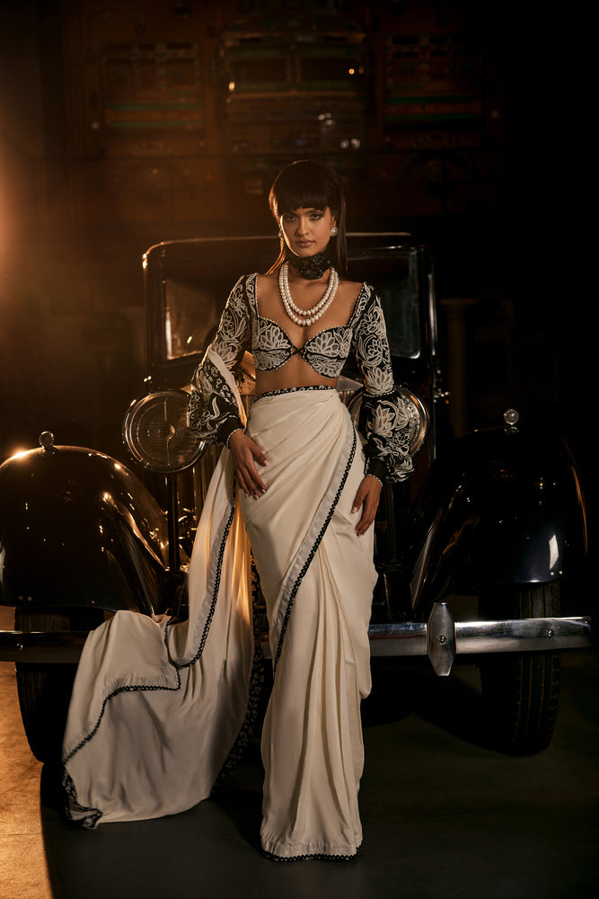 White summer crepe saree paired with black patch work blouse