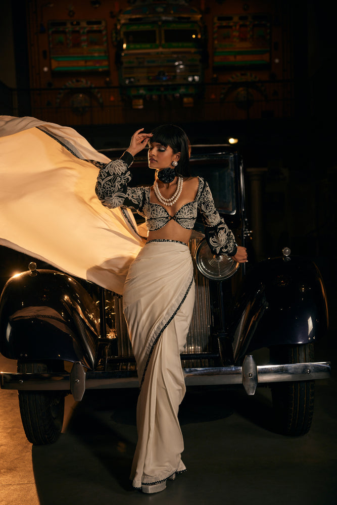 White summer crepe saree paired with black patch work blouse