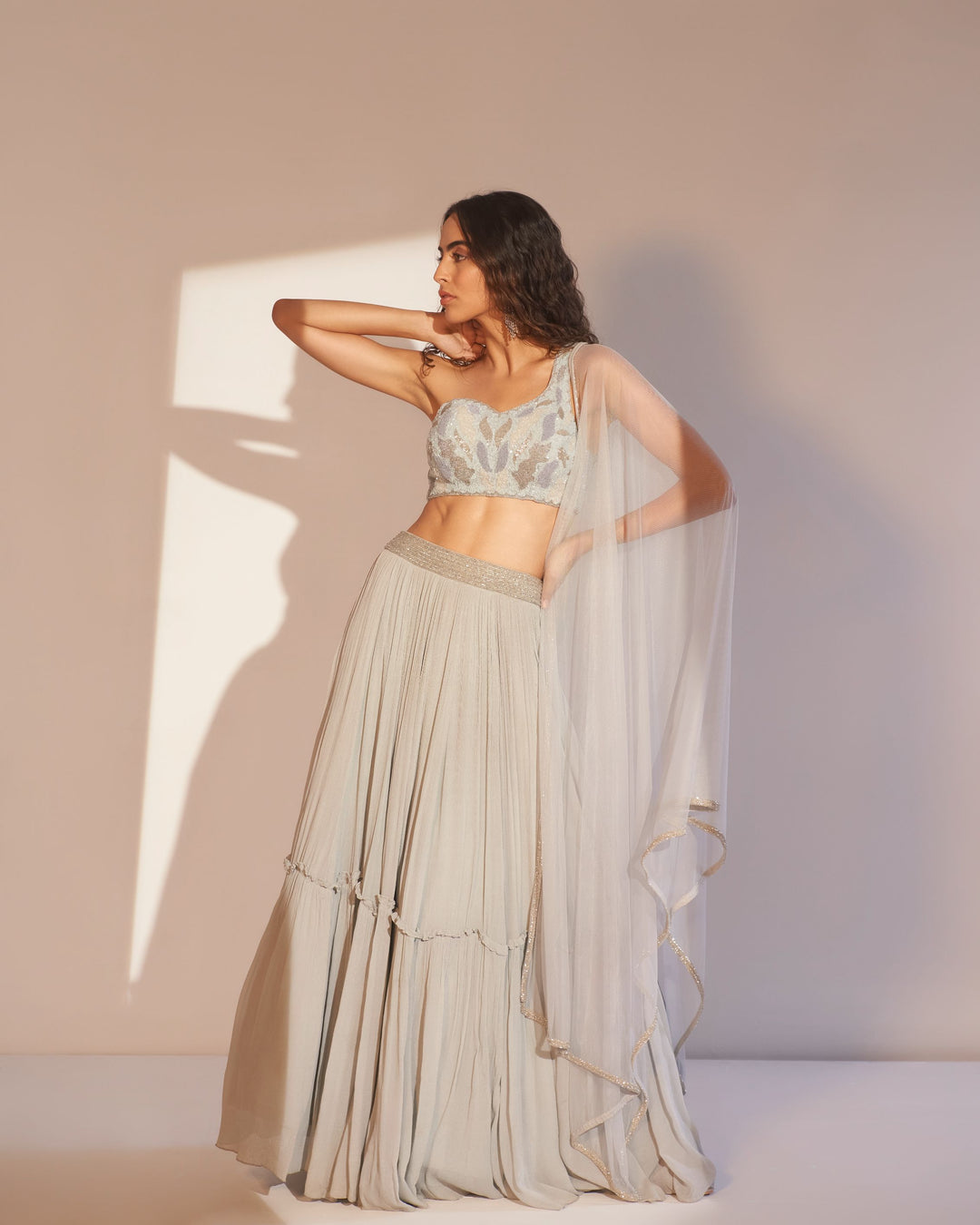 Ice blue lehenga with one shoulder choli